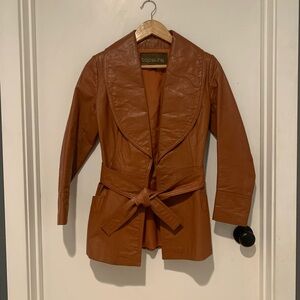 The vintage jacket of your dreams - 1970s women’s tan leather jacket w tie front